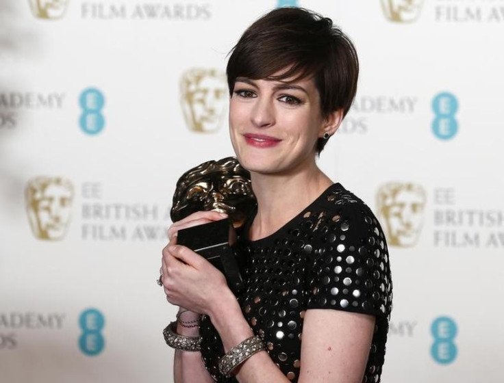 Anne Hathaway celebrates after winning the Best Supporting Actress award for "Les Miserables" at the British Academy of Film and Arts (BAFTA) awards ceremony at the Royal Opera House in London February 10, 2013.