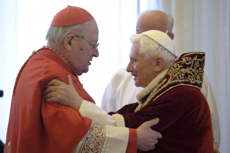Pope Benedict XVI (R) embraces Cardinal Angelo Sodano during a consistory at the Vatican February 11, 2013, in this picture provided by Osservatore Romano.