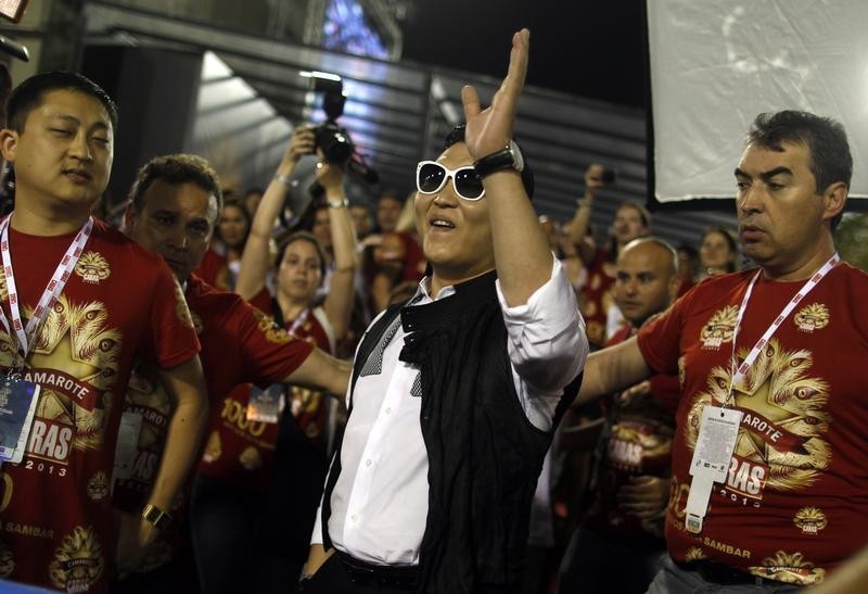 South Korean singer Psy greets revellers during the second night of the A Group annual Carnival parade in Rio de Janeiros Sambadrome February 9, 2013.