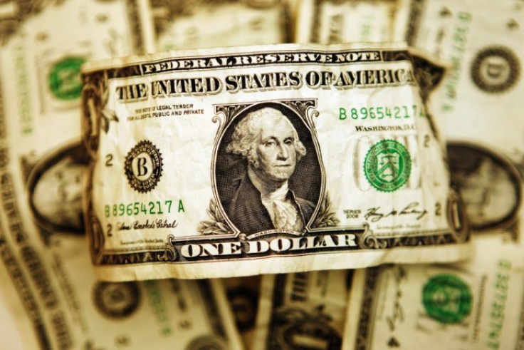 U.S. one dollar bills are displayed in this file photograph. U.S. one dollar bills are displayed in this file photograph.