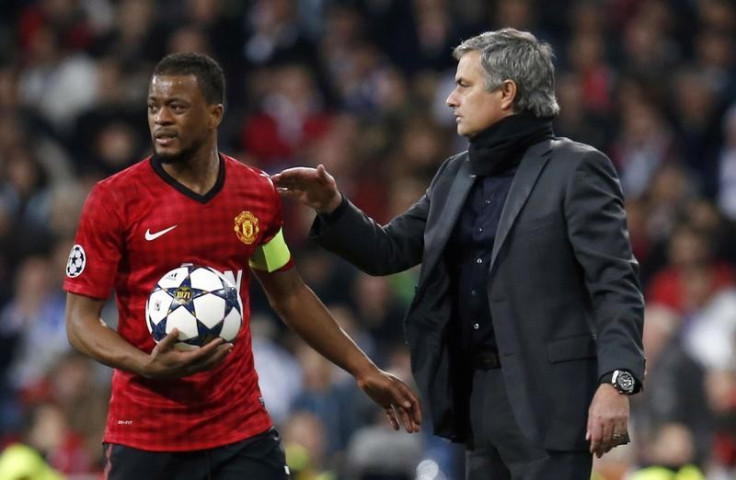 Patrice Evra (L) and Jose Mourinho