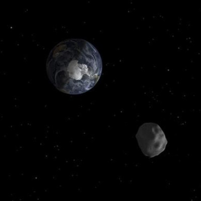 NASA computer generated image of the 2012 DA14 asteroid passing earth.