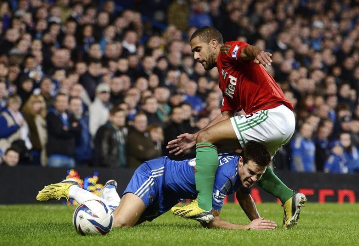 Ashley Williams (R) and Chelsea's Cesar Azpilicueta