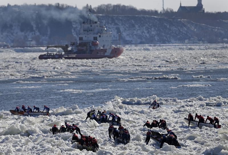 Canoeists compete during the Quebec Winter Carnival ice canoe race on the St. Lawrence river in Quebec City, February 10, 2013.