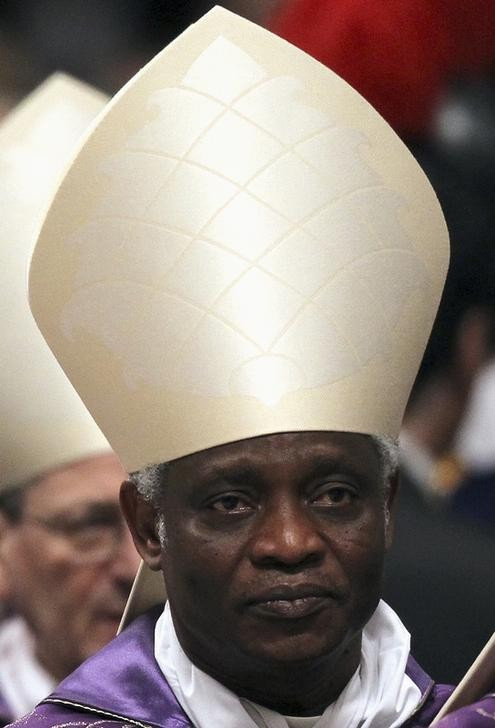 One of the frontrunners for the pontiff’s job, Cardinal Peter Turkson attends the Ash Wednesday mass at the Vatican, February 13, 2013