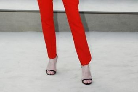 Model Rosie Huntington-Whiteley arrives for the Burberry Prorsum Womenswear Autumn/Winter 2013 Show in Hyde Park during London Fashion Week February 18, 2013.