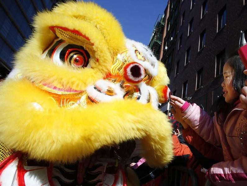 People take part in the 14th Annual Chinatown Lunar New Year Parade in New York, February 17, 2013. This year celebrates the year of the snake, according to the Chinese calendar.