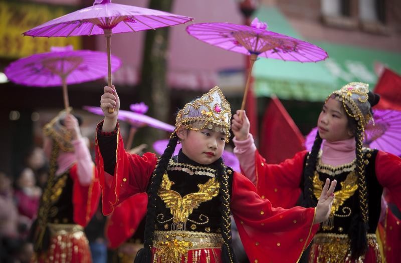 Girls perform a traditional dance during the Chinese New Year parade in Vancouver, British Columbia February 17, 2013. According to the Chinese zodiac, the Lunar New Year began on February 10 and marks the start of the Year of the Snake.