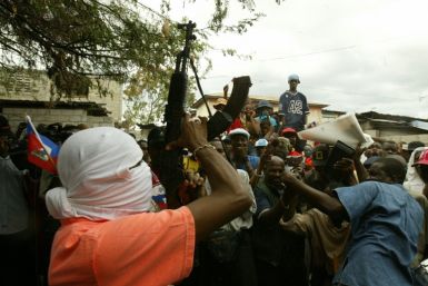 A masked leader of the Base Cameroon gang (Reuters