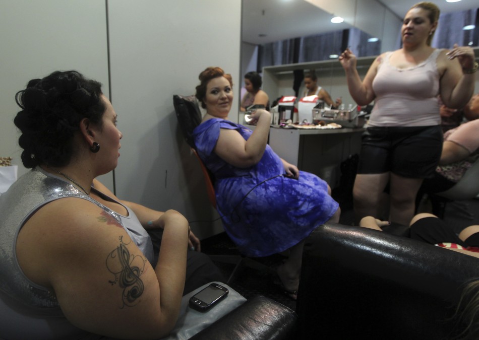 Models prepare backstage before a presentation as part of Fashion Weekend Plus Size FallWinter 2013 collection show in Sao Paulo February 23, 2013.
