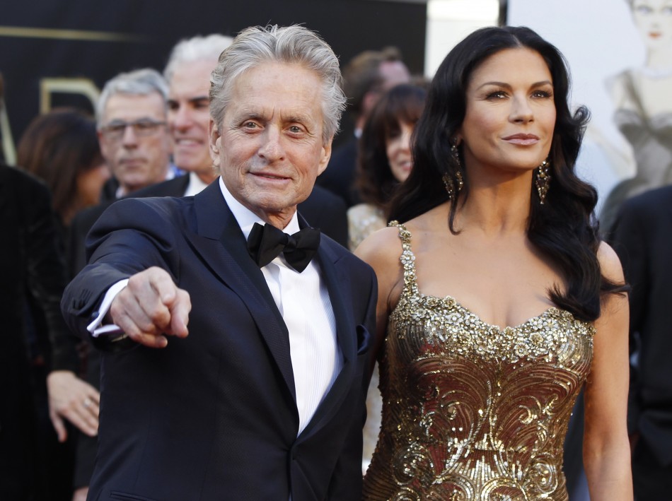 Actor Michael Douglas and his wife, actress Catherine Zeta-Jones, who is wearing a Zuhair Murad gown and Lorraine Schwartz jewels, arrive at the 85th Academy Awards in Hollywood, California, February 24, 2013.