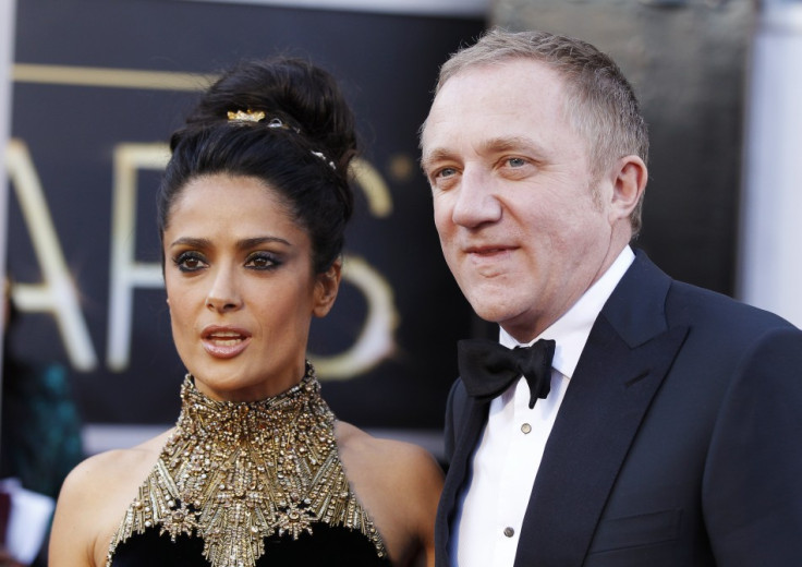 Actress Salma Hayek and her husband Francois-Henri Pinault arrive at the 85th Academy Awards in Hollywood, California February 24, 2013.