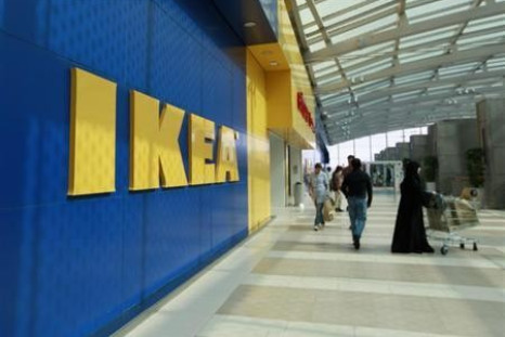 Customers walk near the entrance of an IKEA store (Reuters)
