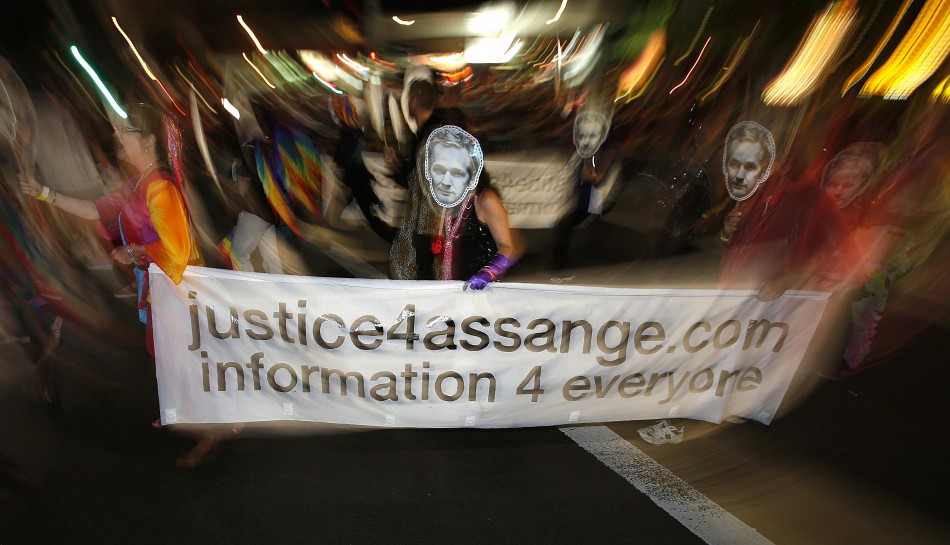 Members of the group Save Assange Wikileaks Coalition participate in the 35th annual Sydney Gay and Lesbian Mardi Gras parade March 2, 2013.