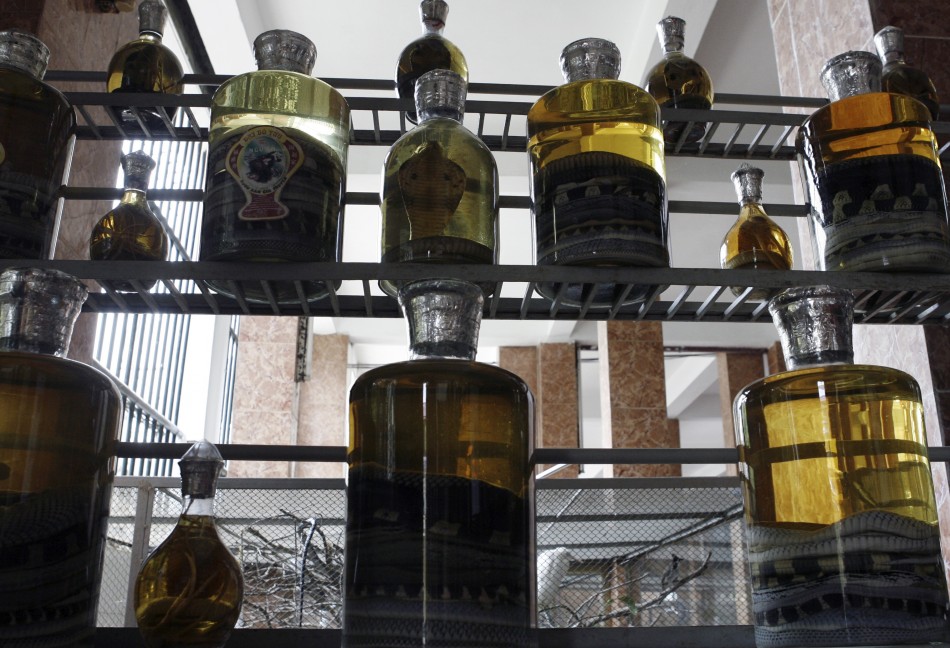 Bottles of snake wine are displayed at a restaurant at Le Mat, dubbed Snake Village, some 10 km 6 miles east of Hanoi May 9, 2007. Le Mat, a village of new houses, old shanty homes, winding alleys and ancient temples with Chinese-style roofs