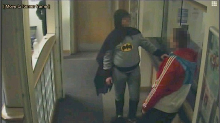 Batman and the suspect at Trafalgar House police station in Bradford (West Yorkshire Police)