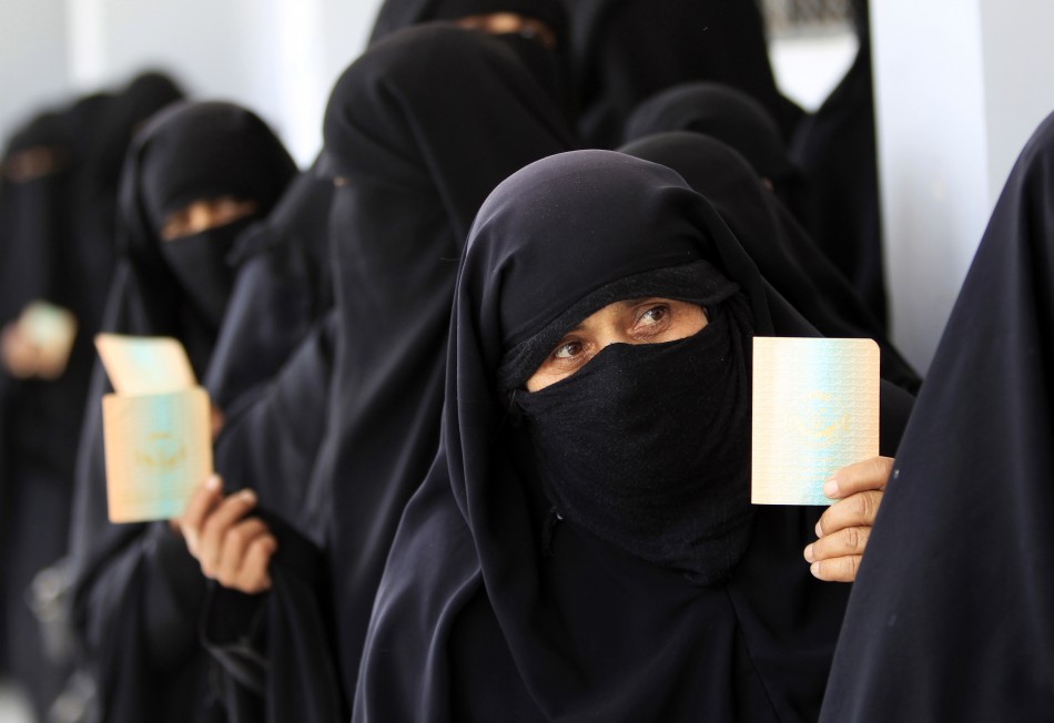 Women queue inside a polling station during presidential elections in Al Hasaba neighborhood in Sanaa February 21, 2012.
