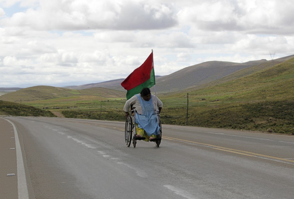 A physically disabled woman on her wheelchair leads a march near Caracollo, some 170 km 106 miles from La Paz, February 11, 2012.