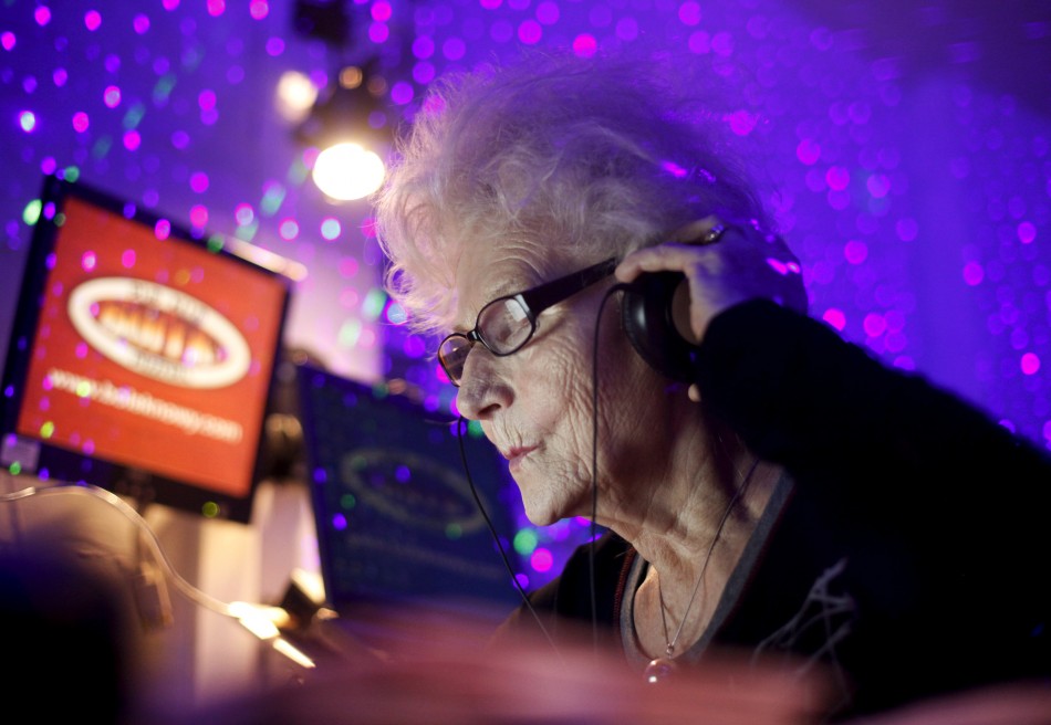 DJ Wika Szmyt plays music at a club in Warsaw January 4, 2012. Szmyt, 73, spends her retirement days behind a DJ console watching people dance to her rhythms. She plays disco, rumba or samba for a mostly elderly audience because she feels she is giving th