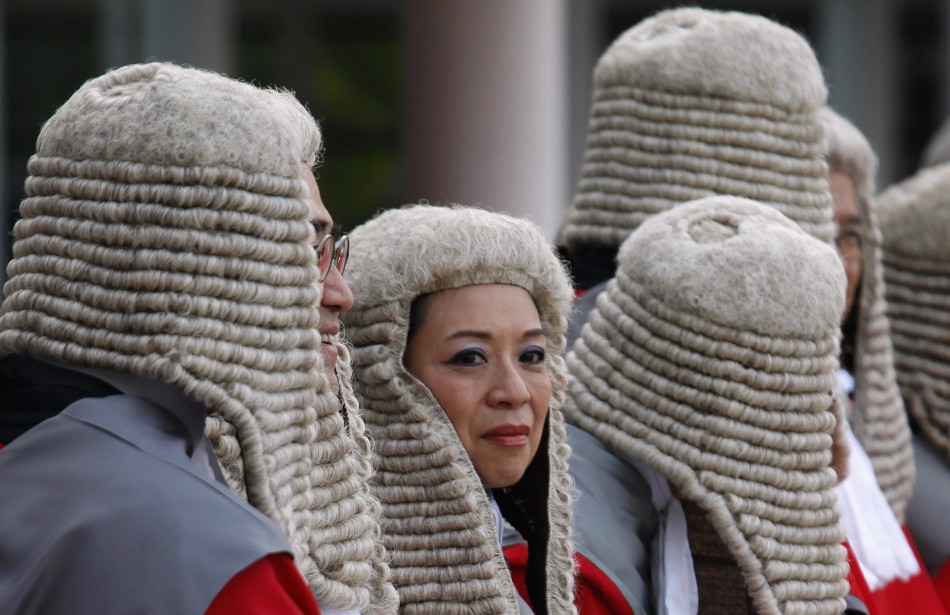 Judges wearing wigs attend a ceremony to mark the beginning of the new legal year in Hong Kong January 9, 2012. The territory continued its common law system after it reverted to Chinese rule in 1997.