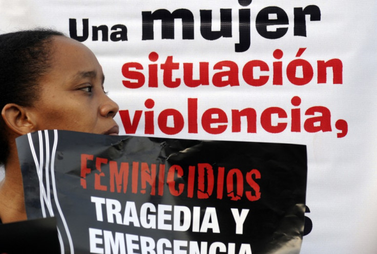 A woman takes part in a rally against femicide, organized by activists and relatives of women who were killed or abused