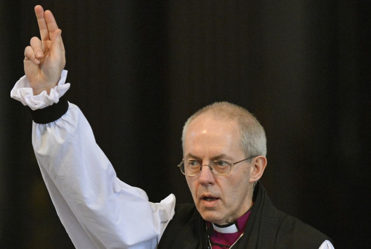 Justin Welby, the new Archbishop of Canterbury, gives a blessing at the close of the ceremony to confirm his election as Archbishop (Reuters)