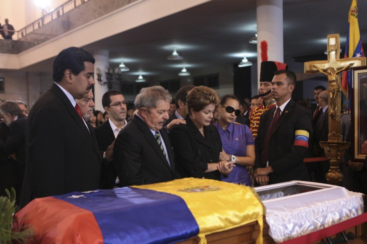 Venezuela Vice-president Nicolas Maduro, former Brazil president Luiz Inacio Lula da Silva, Brazil's current President Dilma Vana Rousseff and Rosa Virginia, daughter of Venezuela's late president Chavez, view Chavez's coffin during a wake at the military