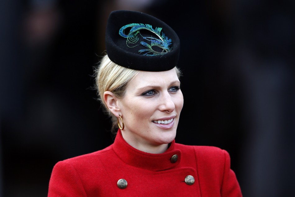 Britains Zara Phillips smiles in the unsaddling enclosure on Ladies Day at the Cheltenham Festival horse racing meet in Gloucestershire, western England, March 13, 2013.
