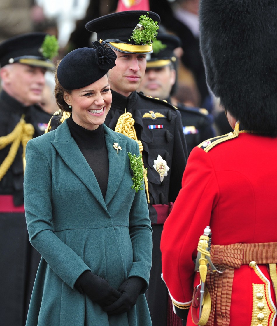 Britains Catherine, Duchess of Cambridge smiles during a visit with her husband, Prince William 3rd L, to attend a St Patricks Day Parade at Mons Barracks in Aldershot, southern England March 17, 2013. Prince William attended the Parade as C