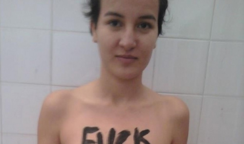 Tunisian activist Amina posts topless picture of herself in support of wome...