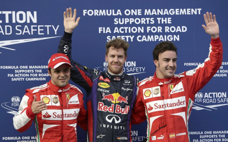 Red Bull's Sebastian Vettel, flanked by Ferrari's Felipe Massa (L) and Fernando Alonso