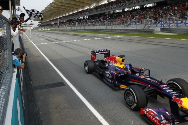 Sebastian Vettel takes the chequered flag