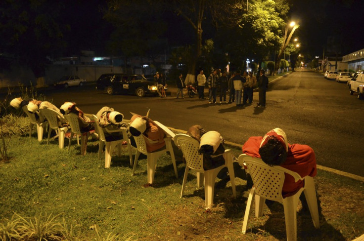 The bodies of seven men arranged in chairs are pictured in Uruapan, in the Mexican state of Michoacan (Reuters)