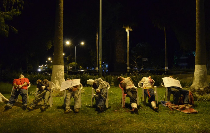 The men were shot in the head with threat messages nailed to some of their chests using ice picks (Reuters)