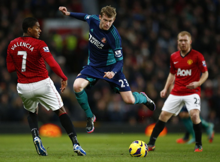 Antonio Valencia (L) and James McClean (C)