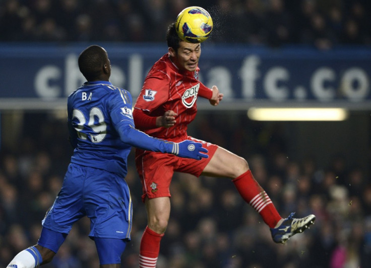 Demba Ba (L) and Maya Yoshida