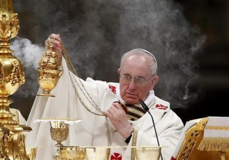 Pope Francis holds the incense burner as he leads a vigil mass during Easter celebrations at St. Peter's Basilica in the Vatican March 30, 2013.