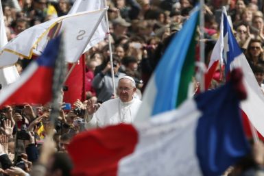 Pope Francis waves as he leaves at the end of the Easter mass in St. Peter's Square at the Vatican March 31, 2013.