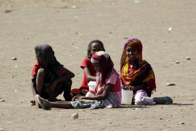 Refugee girls play during a visit by UN High Commissioner for Refugees Antonio Guterres to the Shagarab Eritrean Refugees camp at Kassala in East Sudan