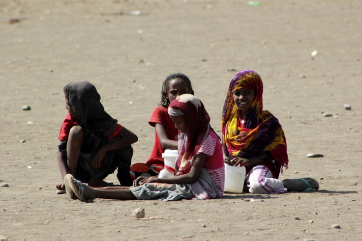 Refugee girls play during a visit by UN High Commissioner for Refugees Antonio Guterres to the Shagarab Eritrean Refugees camp at Kassala in East Sudan