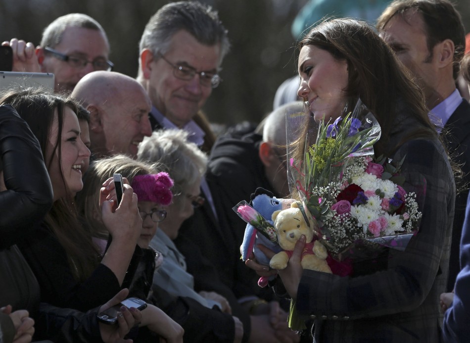 Britains Catherine, Duchess of Cambridge speaks with well-wishers as she arrives at the Donald Dewar centre in Glasgow, Scotland April 4, 2013.