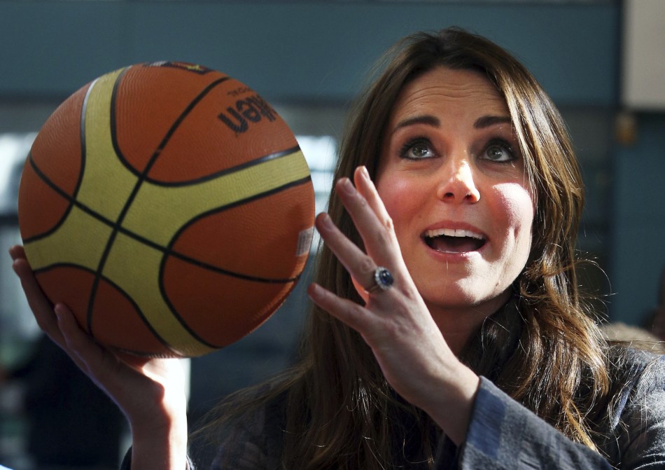 Britains Catherine, Duchess of Cambridge plays basketball during her visit to the Donald Dewar centre in Glasgow, Scotland April 4, 2013.
