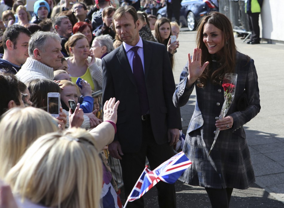 Britains Catherine, Duchess of Cambridge waves to well-wishers as she arrives at the Donald Dewar centre in Glasgow, Scotland April 4, 2013.