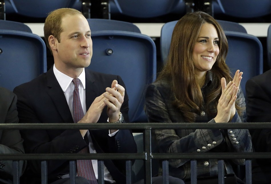 Britains Prince William and his wife Catherine, Duchess of Cambridge applaud during their visit to the Emirates Arena in Glasgow, Scotland April 4, 2013.