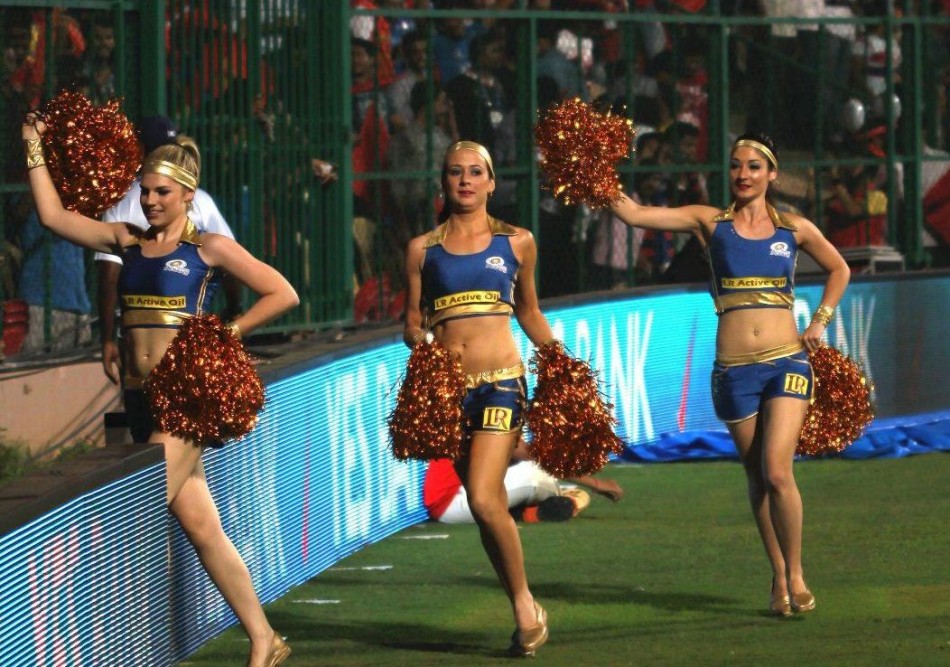 The Mumbai Indians cheerleaders entering the stadium during match 2 of of the Pepsi Indian Premier League between The Royal Challengers Bangalore and The Mumbai Indians held at the M. Chinnaswamy Stadium, Bengaluru on the 4th April 2013