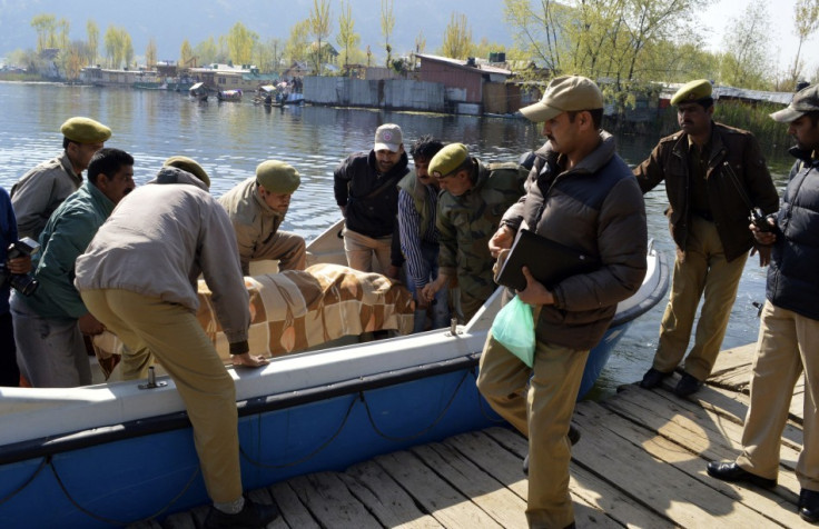 Indian police removed the body of a British woman found stabbed to death on a houseboat in Kashmir