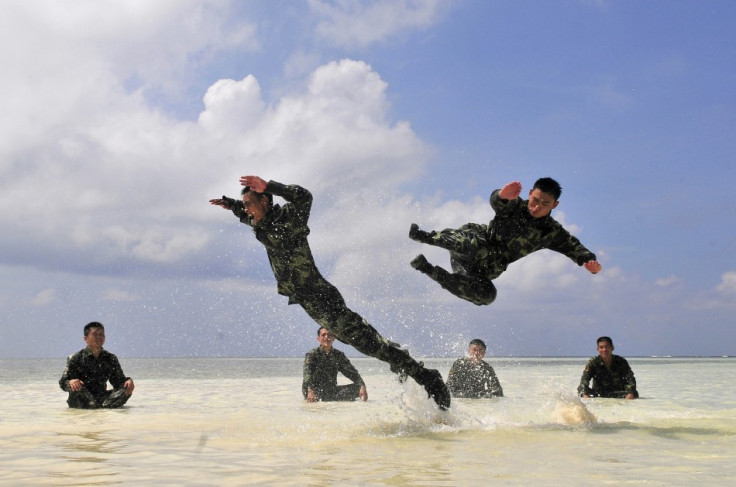 Chinese soldiers exercise during a training session at a beach on the Xisha islands