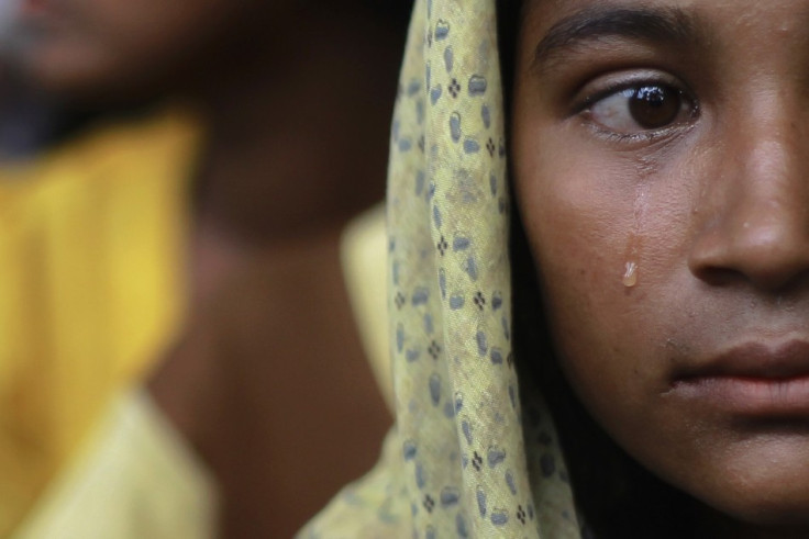 A woman displaced by the recent violence in the Kyukphyu township cries after arriving to Thaechaung refugee camp