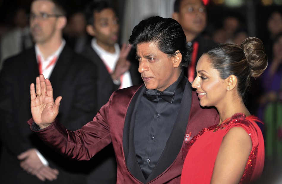 Actor Shah Rukh Khan and his wife Gauri Khan arrive for the inaugural Times of India Film Awards in Vancouver, British Columbia April 6, 2013.