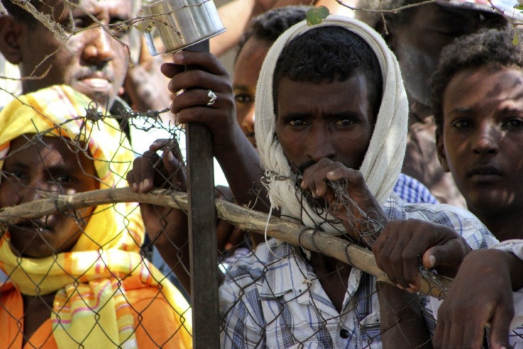 Refugees are seen during a visit by UN High Commissioner for Refugees Antonio Guterres to the Shagarab Eritrean Refugees camp